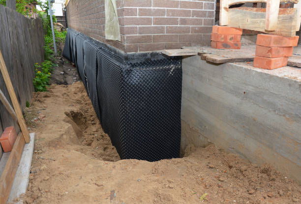 SJ Waterproofing Pros technician performing targeted Basement Waterproofing assessment in Citronelle, AL